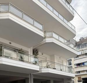 a large building with balconies on the side of it at Achinoeè in Chalkida