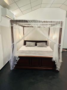 Ένα ή περισσότερα κρεβάτια σε δωμάτιο στο Walwa palm villa