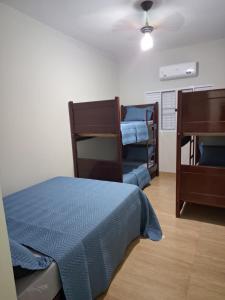 En eller flere senge i et værelse på Chacara Flores em Vida - Olímpia SP