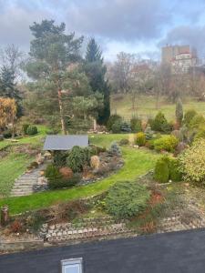 a garden with a bench in the middle of a yard at Apartman Riegrova 41 in Děčín