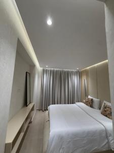 Postel nebo postele na pokoji v ubytování Apartment City Center Hilton Tanger