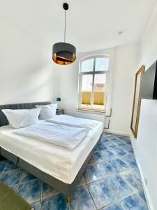 Postel nebo postele na pokoji v ubytování Familienfreundliche Ferienwohnung Sonnenhut