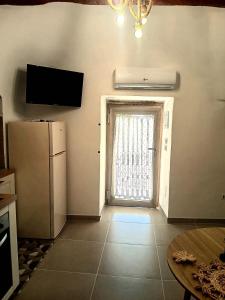 Μια τηλεόραση ή/και κέντρο ψυχαγωγίας στο Trulli Donna Grazia +8 φωτογραφίες