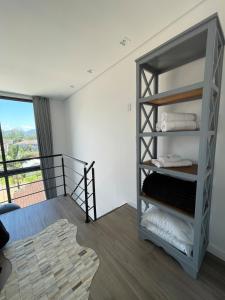 a room with a bunk bed and a staircase at Apartamento Texas in Pomerode