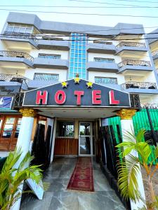 a hotel building with a sign that reads hotel at Appart'hôtel Micheline Suites & SPA, Bastos in Yaoundé