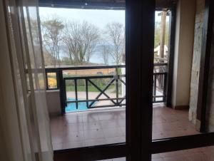 a view from an open door of a balcony at Paradise in Burgas City