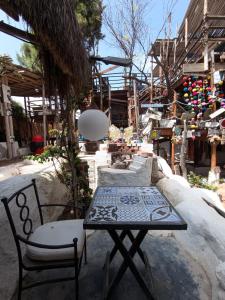 a table and two chairs and a table and a table and chairs at Seafront Flat in Máncora