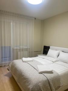 Giường trong phòng chung tại Silver Vytauto Apartments