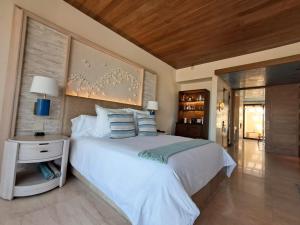 Ένα ή περισσότερα κρεβάτια σε δωμάτιο στο Sea Horizons