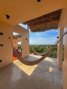 a hammock in a house with a view at Casa Melon 1BR Spectacular Private Oceanview Terrace in Santa María Colotepec