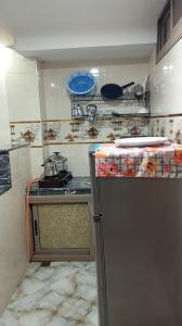 a kitchen with a refrigerator and a counter top at Dar Bouchikhi in Moulay Yacoub