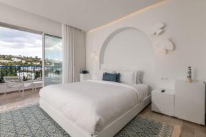 Ένα ή περισσότερα κρεβάτια σε δωμάτιο στο Neira Boutique Hotel & Spa +54 φωτογραφίες