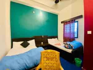 Postel nebo postele na pokoji v ubytování Hotel MAQ Lumbini