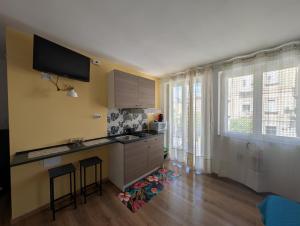 a kitchen with a sink and a counter top at Casa Euripide in Syracuse