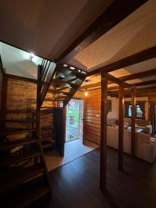 a bedroom with a bed and a staircase in a room at The Lake Breeze Bay in Plav