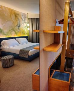 a bedroom with a bed and a bunk bed at Hotel Liola' in Castrocielo