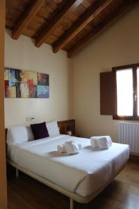 Ένα ή περισσότερα κρεβάτια σε δωμάτιο στο Hostal Musunzar