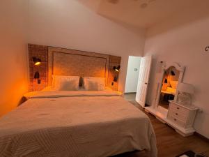 Ένα ή περισσότερα κρεβάτια σε δωμάτιο στο Casa colonial filandia +29 φωτογραφίες