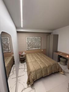 Ένα ή περισσότερα κρεβάτια σε δωμάτιο στο Porta Bari Rooms