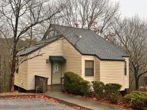 a small white house with a black roof at IGLS Resort Villas at Innsbruck in Helen