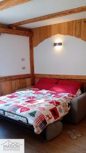 En eller flere senge i et værelse på La Maison de Charlotte - Val di Fiemme