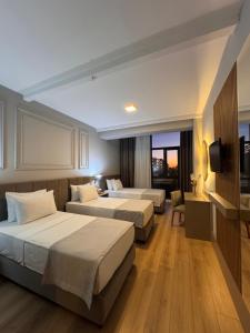 Ένα ή περισσότερα κρεβάτια σε δωμάτιο στο Remida Managed By Dedeman