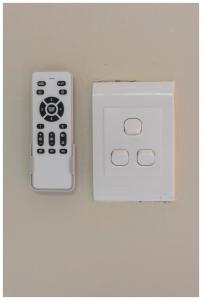 two switches on a wall next to each other at Ekuhlaleni Room 6 in Pretoria