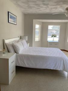 Ένα ή περισσότερα κρεβάτια σε δωμάτιο στο Historic Cocoa Village Riverwalk