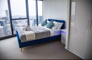 Ένα ή περισσότερα κρεβάτια σε δωμάτιο στο Luxury Beachside Apartment