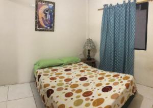 Ένα ή περισσότερα κρεβάτια σε δωμάτιο στο hospedaje Maluli 04