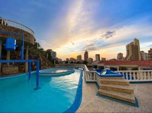 a swimming pool with a view of a city at Grand Villa Roca Rodadero in Rodadero