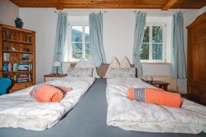 Ένα ή περισσότερα κρεβάτια σε δωμάτιο στο Müllers Ferienhaus Salzburgerland