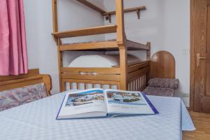 a book sitting on top of a table at Apartment - Alpin Chalet Frenademetz in San Martino in Badia