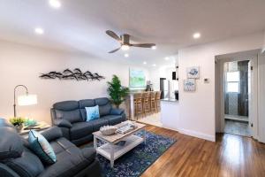 a living room with a couch and a table at 400 South - Unit G in Cocoa Beach