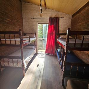 Ένα ή περισσότερα κρεβάτια σε δωμάτιο στο Chalé Hibiscus