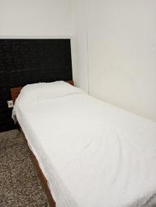 Ένα ή περισσότερα κρεβάτια σε δωμάτιο στο Depto Cerezos