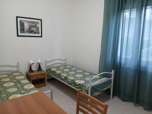 Ένα ή περισσότερα κρεβάτια σε δωμάτιο στο Casa Adria