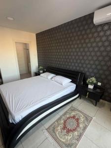 Giường trong phòng chung tại Magnifique appartement résidence