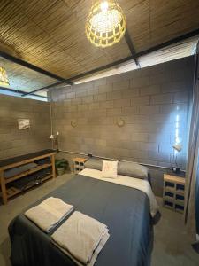 Postel nebo postele na pokoji v ubytování Cabañas del bosque