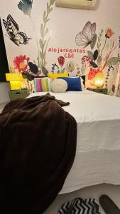 Ένα ή περισσότερα κρεβάτια σε δωμάτιο στο C&E APARTAHOTEL, Apartamentos a una calle de la Playa & Malecón