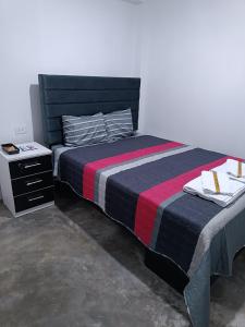 Una cama o camas en una habitación de Hospedaje C y A 3 fotos más