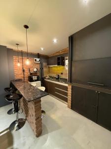 Η κουζίνα ή μικρή κουζίνα στο Departamento Parque, Asador y Pileta Privada, uso exclusivo