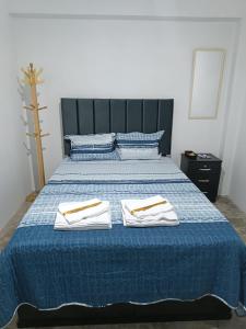 Una cama o camas en una habitación de Hospedaje C y A