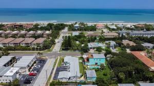 an aerial view of a town with houses and a street at The Juni-7 Unit Renovated Complex in Cocoa Beach