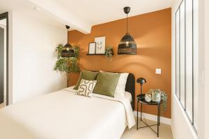 Ένα ή περισσότερα κρεβάτια σε δωμάτιο στο Appartement cosy centre grasse - CLIM