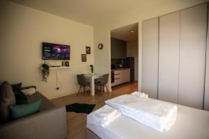 a living room with a couch and a table at BW Gallery in Belgrade