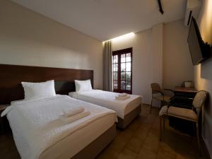 Ένα ή περισσότερα κρεβάτια σε δωμάτιο στο Viva Properties