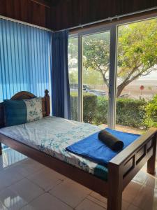 Ένα ή περισσότερα κρεβάτια σε δωμάτιο στο Ban Tidlay - SHA