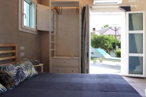 Un pat sau paturi într-o cameră la Il Giardino di Angelo e Margherita