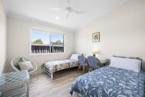 Ένα ή περισσότερα κρεβάτια σε δωμάτιο στο Bluwren